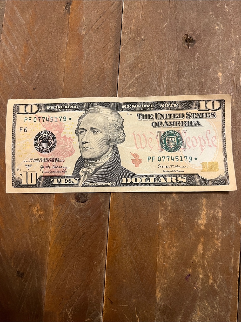 10$ Star note uncertified, circulated.